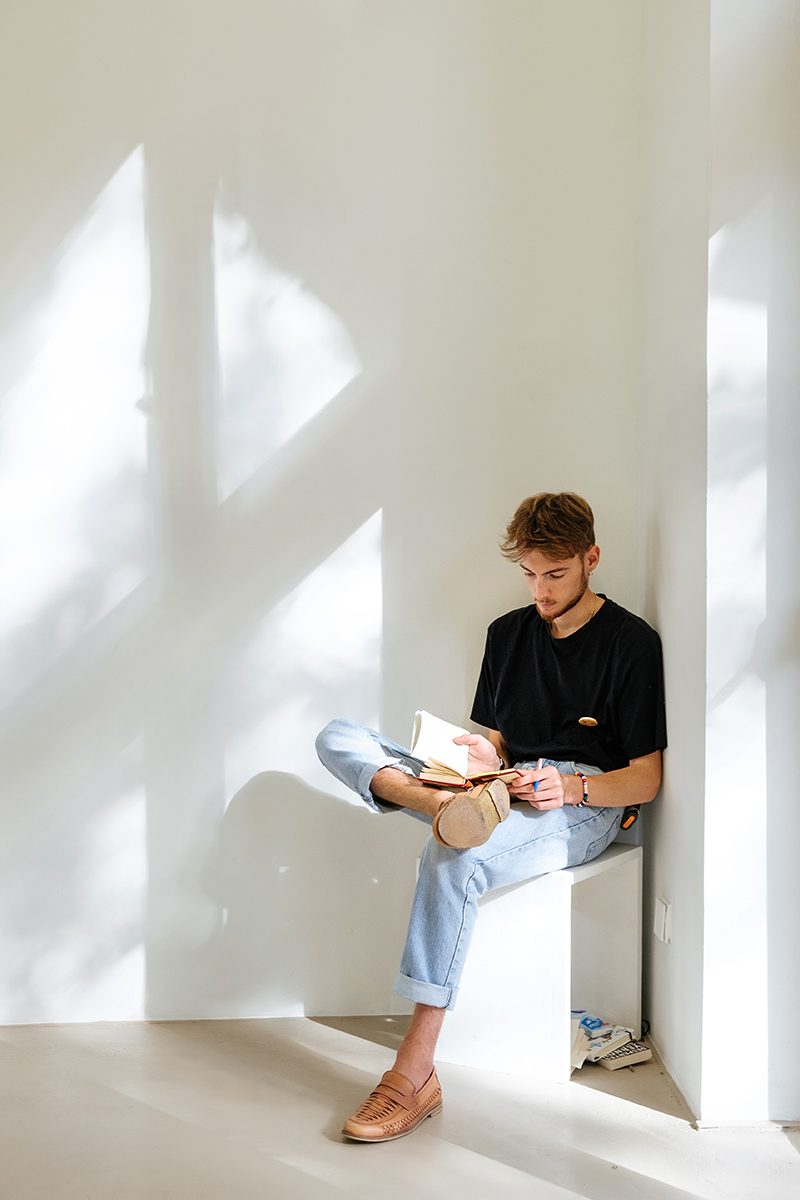 A man reading in a museum