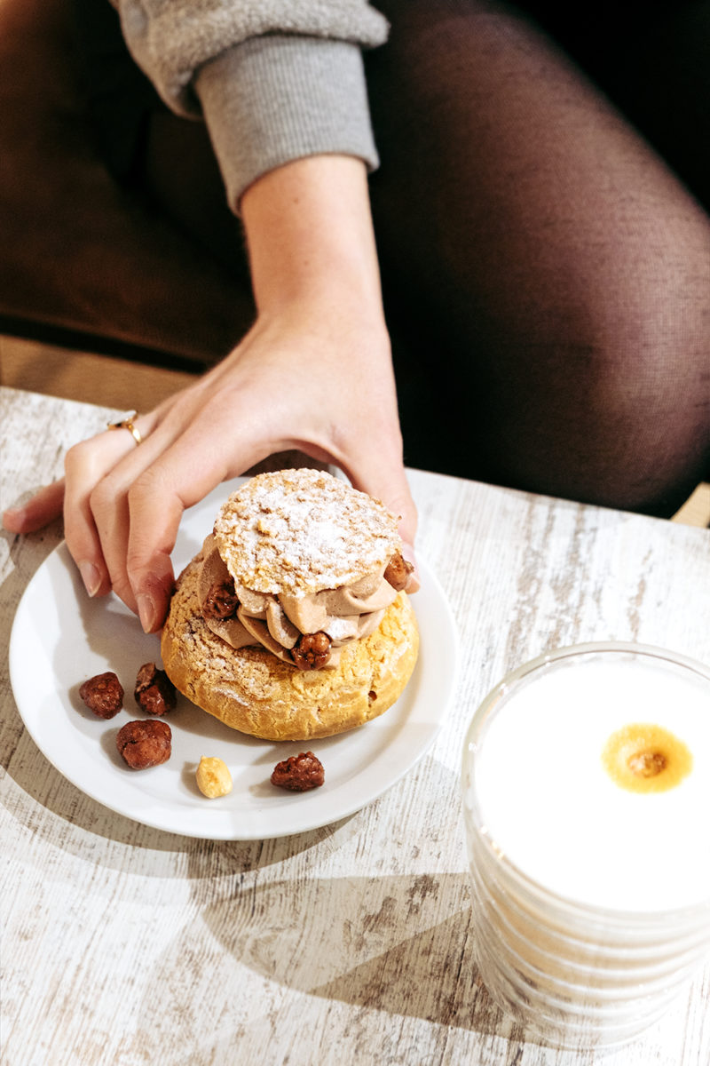 Hand and a Paris-Brest Cookie