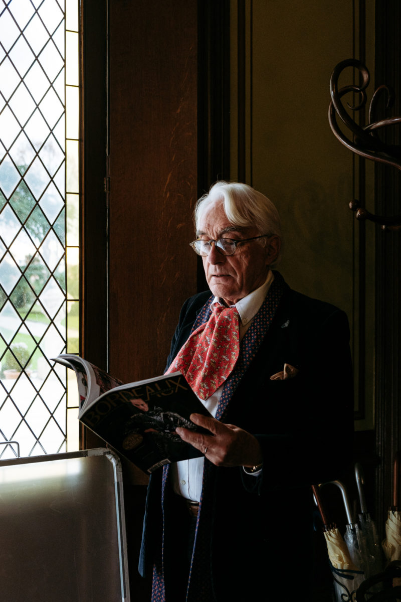 A old rich man reading newspaper